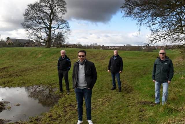 Members of the residents association in the field off Town Ln, Whittle-le-Woods, where new houses are proposed