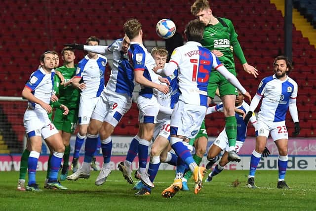 Liam Lindsay climbs to head home North End's second goal against Blackburn