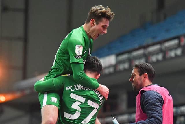 Ryan Ledson jumps on Greg Cunningham to celebrate Preston North End's opening goal against Blackburn at Ewood Park