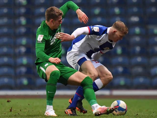 Preston’s Emil Riis battles with Blackburn Rovers’ Jarrad Branthwaite