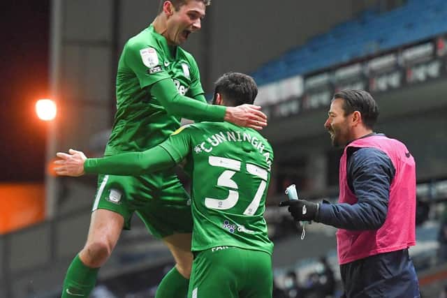 Greg Cunningham celebrates with Ryan Ledson and Joe Rafferty after opening the scoring at Ewood Park.