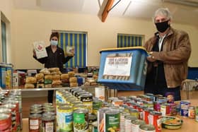 Volunteers from the local community sort through donations at the community centre