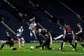 Jordan Storey jumps out of the way of Liam Lindsay's shot in Preston North End's defeat to Watford at Deepdale