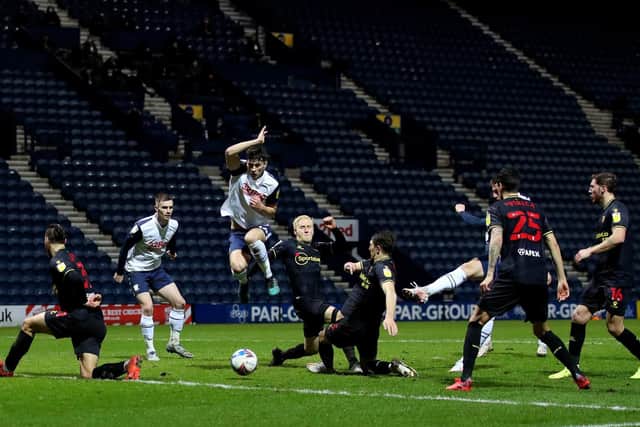 Jordan Storey jumps out of the way of Liam Lindsay's shot in Preston North End's defeat to Watford at Deepdale