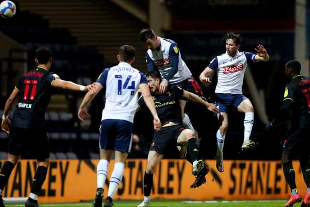 PNE left-back Andrew Hughes heads clear against Watford