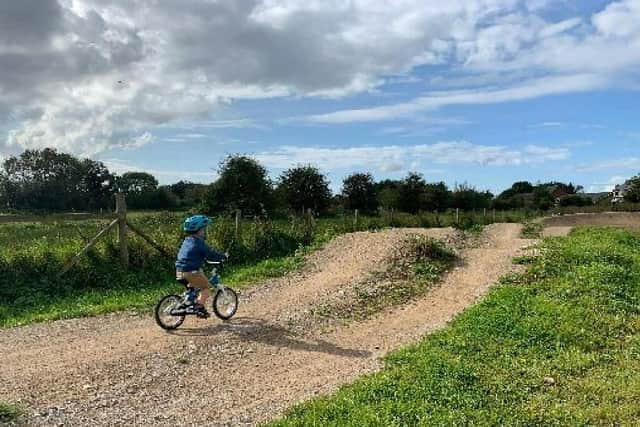 A young rider on the pump track off Smithy Lane