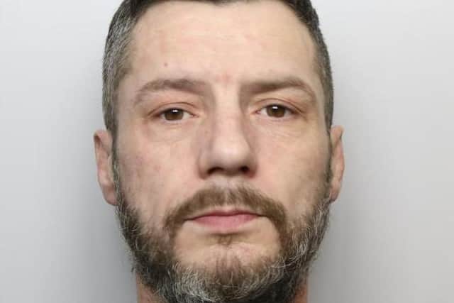 John Elliott (pictured) is described as being of medium build, with greying hair and a beard.