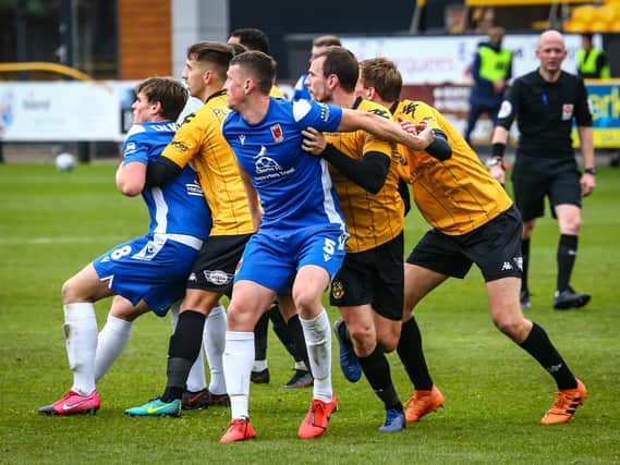 Chorley (blue strip) in action against Southport
(photo: Stefan willoughby)