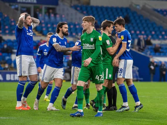 Cardiff players protest at the awarding of a second penalty against Preston