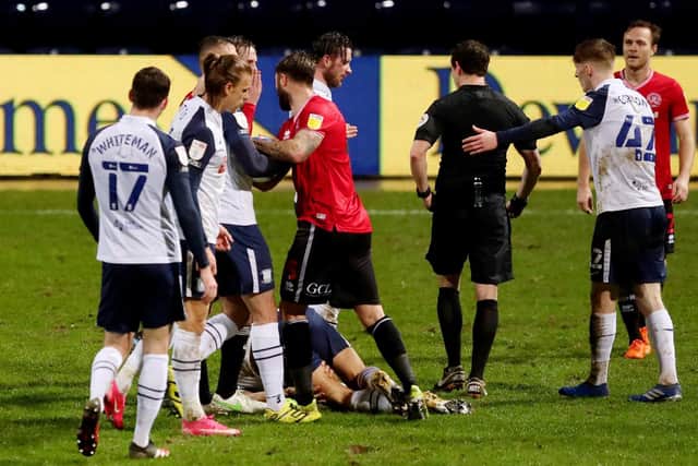 North End striker Ched Evans is left on the floor after being challenged
