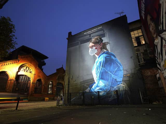 A mural depicting NHS nurse Melanie Senior, based on a photograph by Johannah Churchill, which The National Portrait Gallery commissioned artist Peter Barber to create in Manchester's Northern Quarter (Photo by Christopher Furlong/Getty Images)