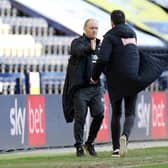 Preston North End manager Alex Neil shakes hands with Huddersfield head coach Carlos Corberan at the final whistle at Deepdale