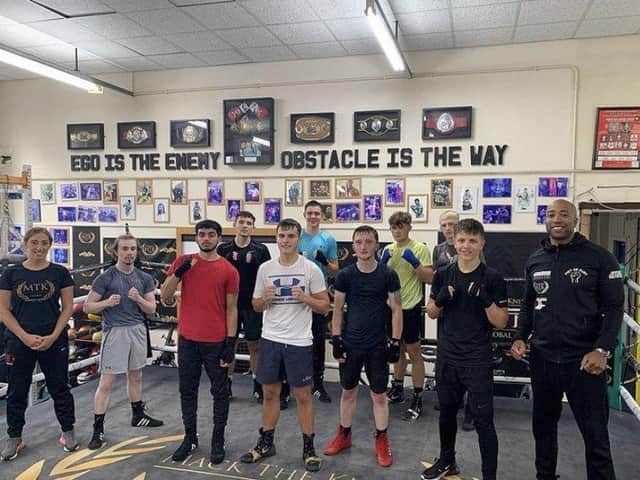 Michelle Nicholson,far left, and Johnney Roye, far right, with MTK Manchester academy students