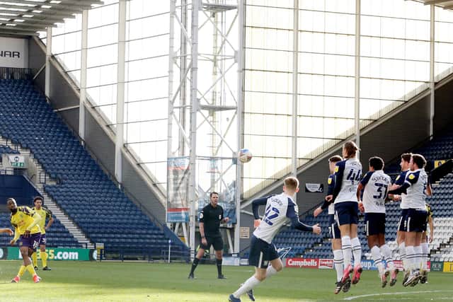 Huddersfield Town’s Isaac Mbenza lifts a first half free-kick over the Preston North End wall