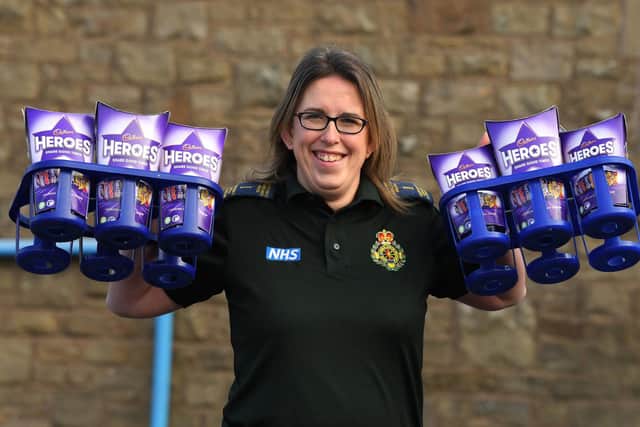 Paramedic and parent Jeanette Fitton with the chocolates collected by Longridge pupils. Photo: Neil Cross