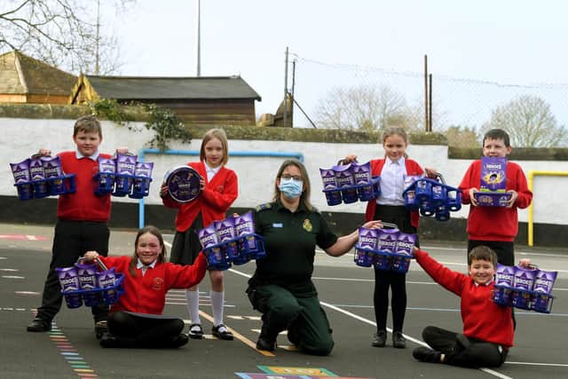 Paramedic Jeanette Fitton collects the Heroes from Longridge pupils. Photo: Neil Cross