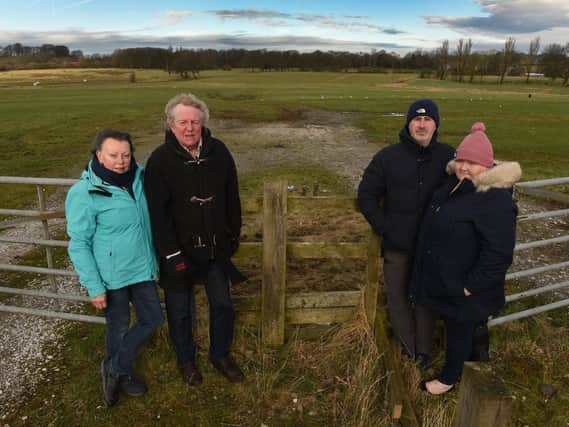 Councillors Gordon and Margaret France and residents Lisa and Richard Curzon at the site of the proposed sand excavation site