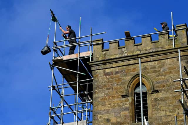 Repairs being made to the tower at St Lawrence's  Photo: Neil Cross