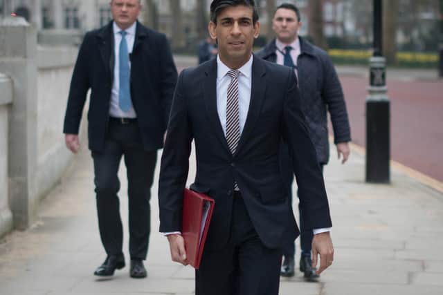 Chancellor of the Exchequer, Rishi Sunak, walks from the Treasury to No 11 Downing Street, London, the day before delivering his budget.