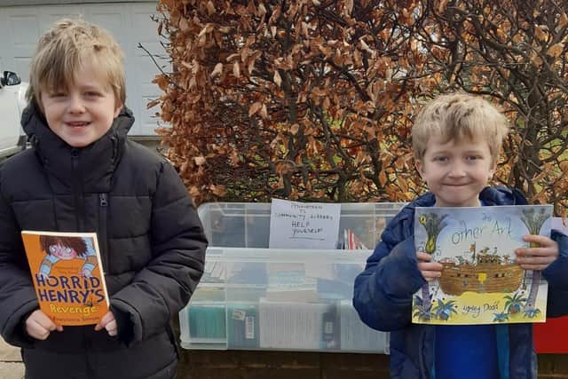 Daniel and Ciaran Whitaker with their box of books