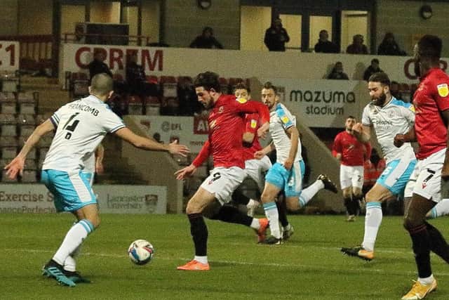 Cole Stockton opens the scoring for Morecambe in their midweek win against Crawley Town