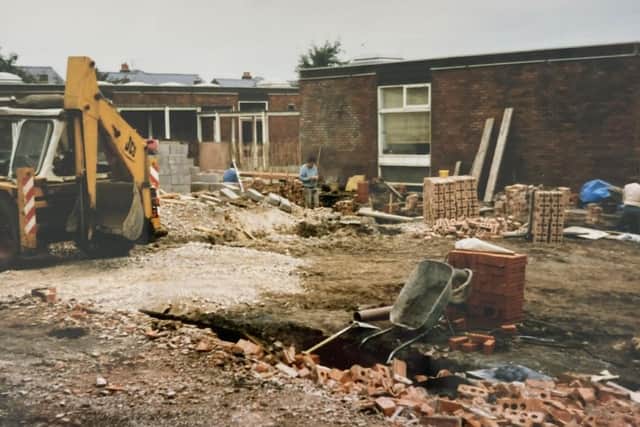 A JCB on site and building works during a school remodel