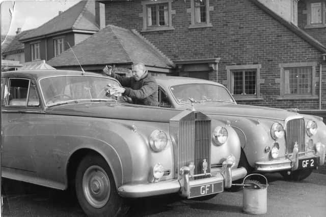 George Formby with his personalised Rolls Royce cars at his home