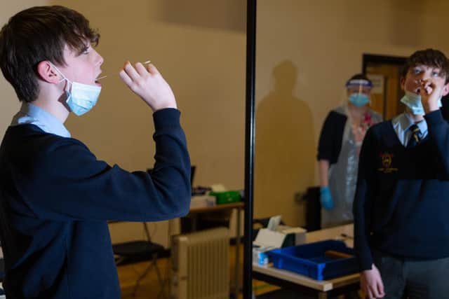 Year 8 pupil, Harrison, performs a coronavirus test at Archbishop Temple School. Photo: Kelvin Stuttard.