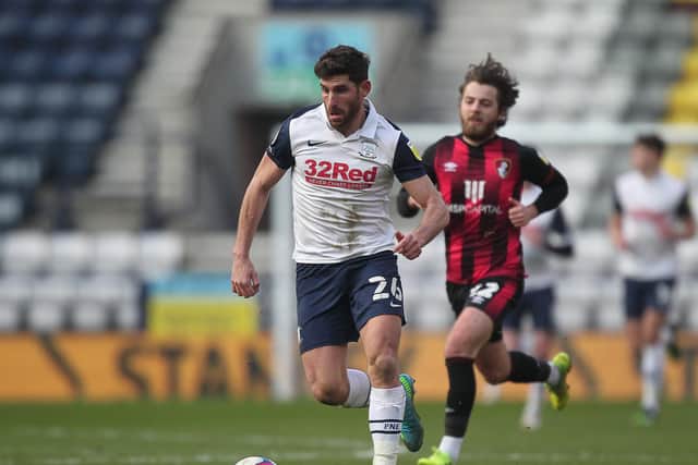 PNe striker Ched Evans on the attack, chased by Ben Pearson