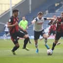 Ched Evans battles with the Bournemouth defence at Deepdale.