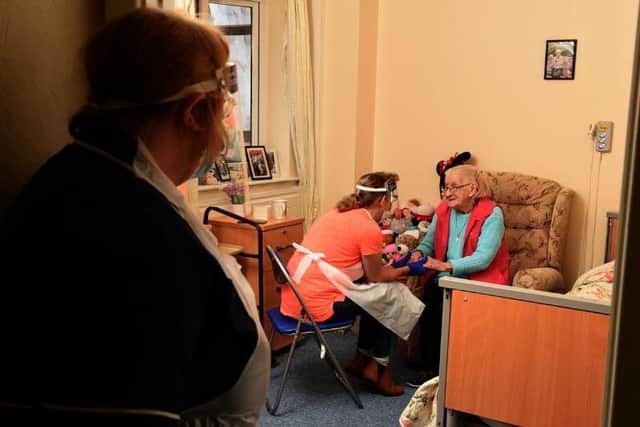 Care home manager Louise Newton watches the heartwarming moment