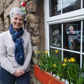 Fiona Elcomb pictured in front of the window display she has created in memory of her friend Janis Whitlock