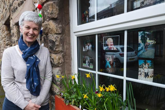 Fiona Elcomb pictured in front of the window display she has created in memory of her friend Janis Whitlock