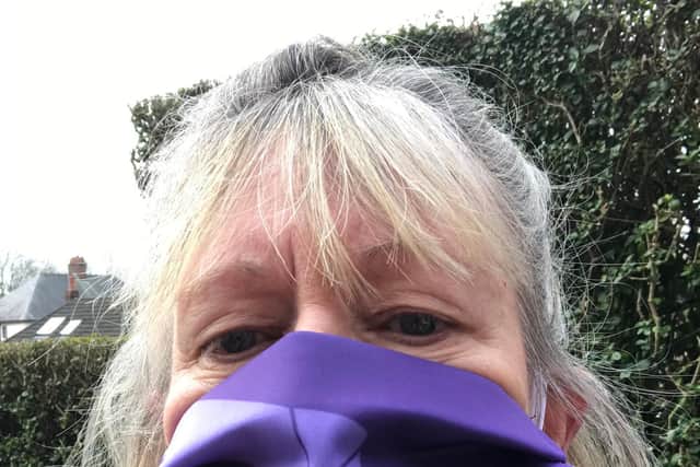 Janet Newsham, Greater Manchester Hazard Centre, wearing her International Workers' Memorial Day mask.