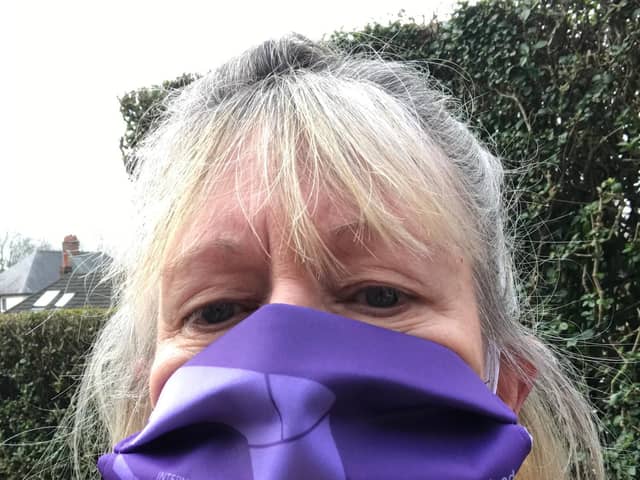 Janet Newsham, Greater Manchester Hazard Centre, wearing her International Workers' Memorial Day mask.