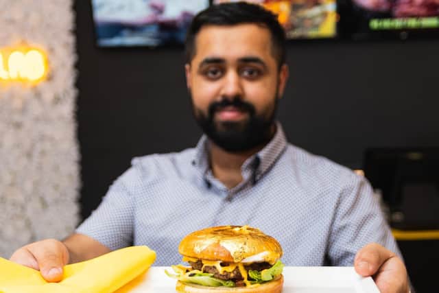 Mohammed Khan, 26, with the burger