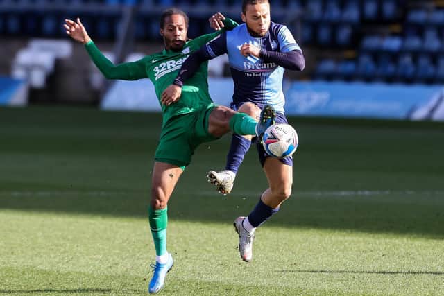 PNE midfielder Daniel Johnson challenges for possession against Wycombe