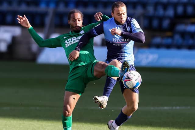 North End’s Daniel Johnson battles with Wycombe’s Curtis Thompson at Adams Park