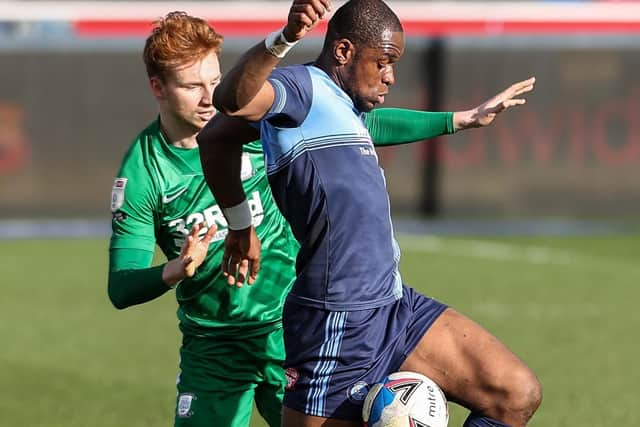 Sepp van den Berg competing with Wycombe Wanderers’ Uche Ikpeazu