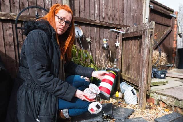 A Leyland nurse says she's been left devastated after tradesmen damaged a memorial to her late son