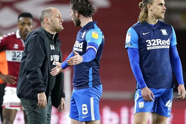 Alan Browne and Alex Neil protest the PNE skipper's red card.