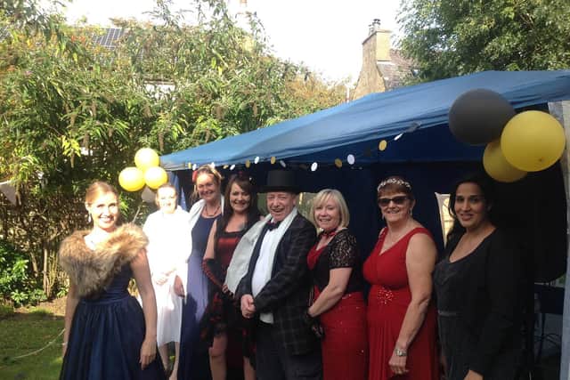 Hollywood garden party at Moorside Hall nursing home with singer Rachel Mercer and members of staff.