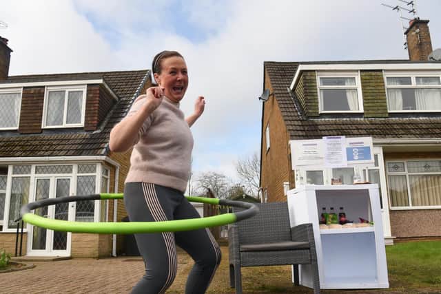 Karen says hula hooping has been helping her keep warm while she looks after her KaZBah stand