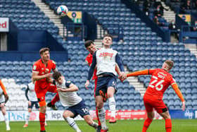 Preston North End defender Liam Lindsay flicks a header goalwards against Luton Town at Deepdale