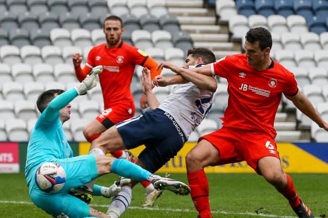 North End striker Ched Evans sees his shot smothered by Luton keeper Simon Sluga