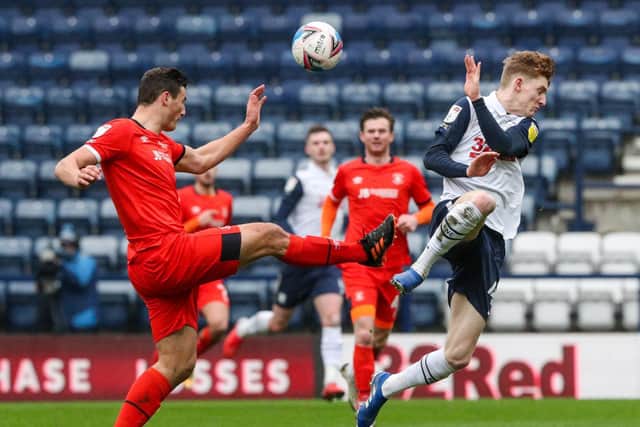 PNE winger Anthony Gordon tries to charge down Matty Pearson's clearance