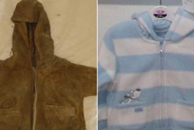 The brown fleece worn by Baby Boy, which is believed to have originally been blue and white like the one pictured