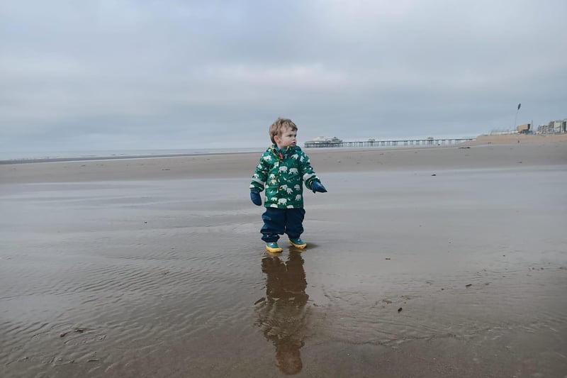 Beth's son Harrison explores an empty beach in Blackpool.