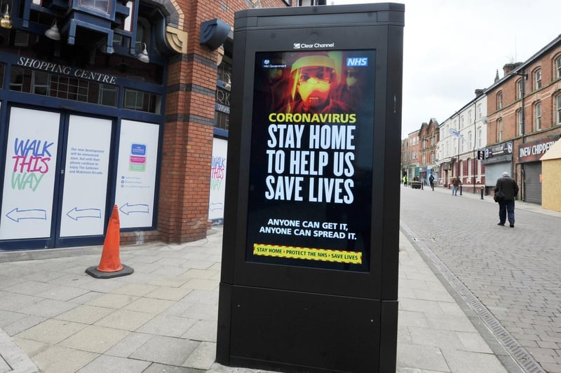 A message to the public, stay at home, protect the NHS, save lives, during the lockdown, pictured on a usually busy Market Street, Wigan.