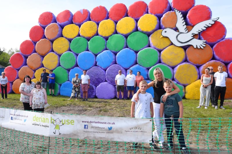 The rainbow became the symbol of hope during the first lockdown, with people displaying colourful artwork in their windows at home, here Gemma Crompton and family, joined by students and their families from The Hamlet, pictured in front of the rainbow hay bales on Winstanley Road, Billinge.